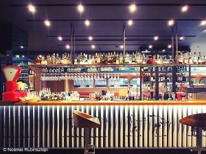 Picture of Sense Hotel in Sofia featuring a bar with one stool. The bar is filled with drinks.