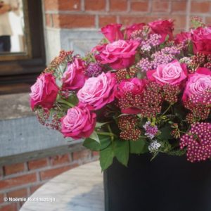 This photo was taken in hotel August in Antwerp, Belgium and features a bouquet of pink roses.